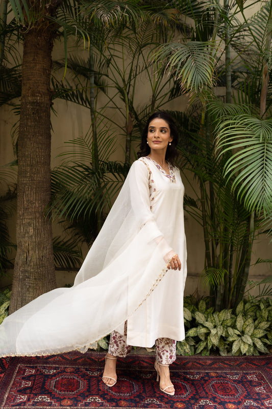 Ivory Chanderi Kali kurta with pants and organza dupatta.